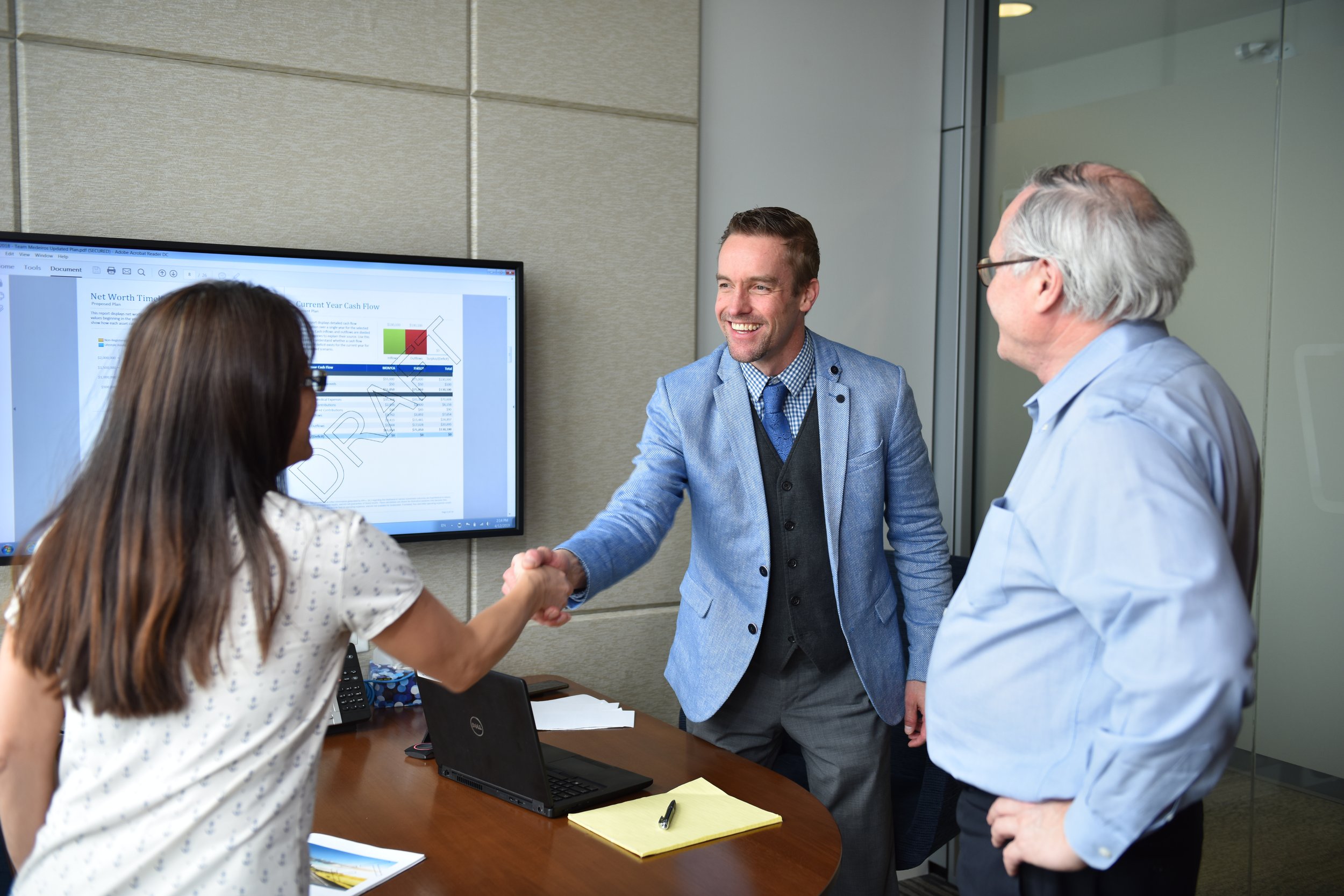 A business consultant meeting with a client in a bright Toronto office