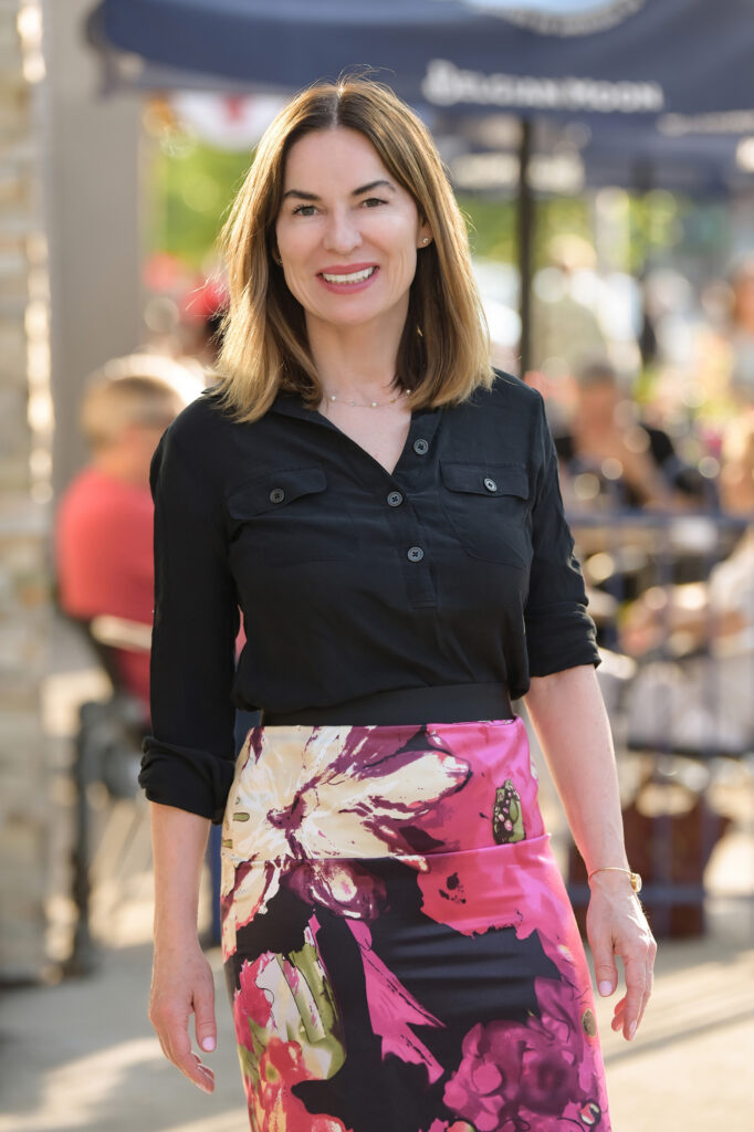 Elegant woman in floral skirt and black top