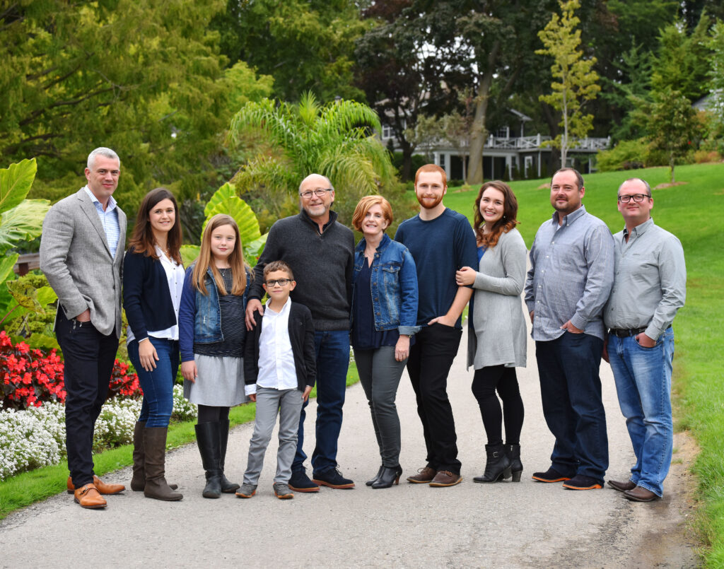 A family reunion photo session in a beautiful garden, showcasing the expertise of the best family photographers near me.