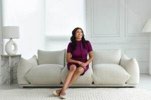 Professional woman in a modern office setting, exemplifying branding photography for entrepreneurs.