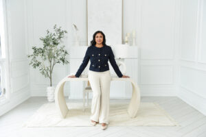 Executive woman posing in a stylish office, highlighting the impact of branding photography.