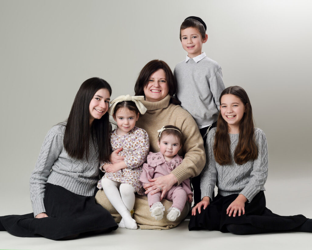 A family portrait session in a studio with a mother and her children, photographed by the best family photographers near me