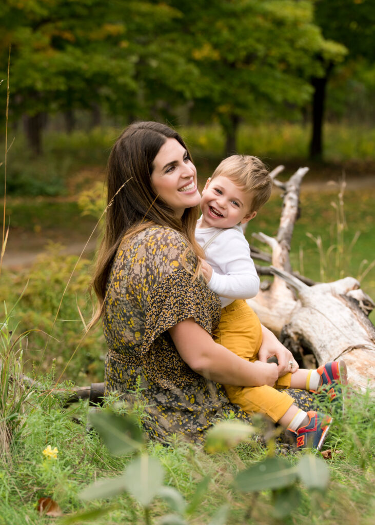 A family enjoying a photoshoot in an autumn park, captured by the best family photographers near me.