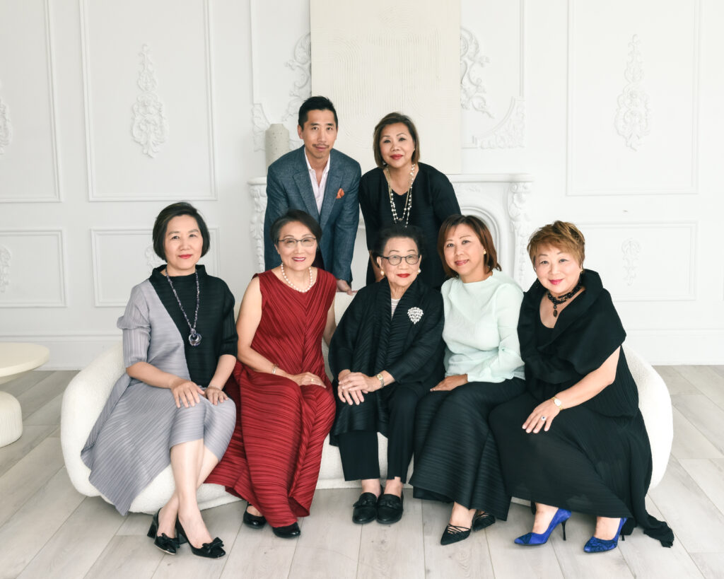 A multi-generational family photo session in a studio, taken by the best family photographers near me, highlighting family bonds.