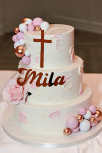 Custom white tired baptism cake