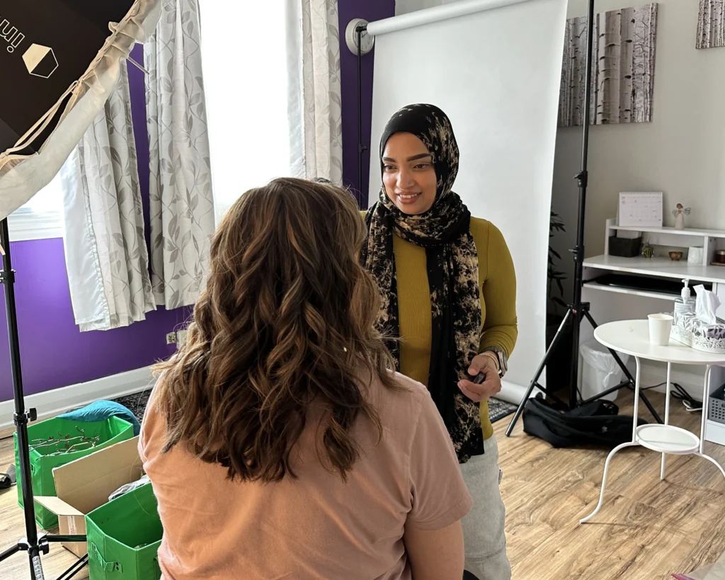 Behind the scenes of a counselor's professional headshot session with makeup artist.