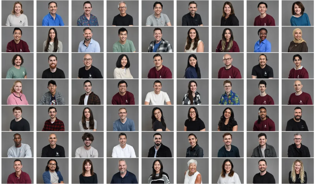 A diverse grid of professional headshots featuring employees in business attire with neutral gray backgrounds, showcasing brand unity and professionalism.